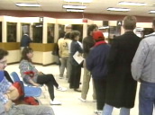People sitting and standing in queues in unemployment office&sbquo;  USA; 1980\%27s
