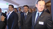 President Pervez Musharraf of Pakistan walks through building protected from well wishers by security guards&sbquo;  Sydney; Jun 05