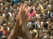 Crowd of singing children in refugee camp set up during Rwandan civil war&sbquo;  Democratic Republic of Congo; 1994