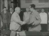 Soviet President Nikita Khrushchev exchanges documents then shakes hands with Chairman Mao Tse-Tung&sbquo;  China; late 1950\%27s