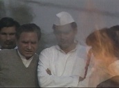 Rajiv Gandhi watches his mother Indira Gandhi\%27s funeral pyre burn&sbquo;  Delhi; 1984