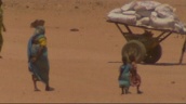 People walk along desert land during heat haze&sbquo;  Darfur&sbquo; Sudan; Sep 04