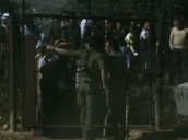 Zoom in to Israeli troops at security gate&sbquo;  Lebanon border; November 1976