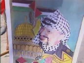 Palestinian boy scouts marching&sbquo;  one holding picture of Yasser Arafat&sbquo; Gaza; July 1994