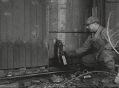 US federal agents use axes to smash tanks at illegal distillery in countryside&sbquo;  USA; 1935