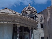 Zoom out from bomb damaged dome to abandoned palace&sbquo;  Tikrit; 14 Apr 2003