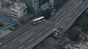 Bus perched on edge of collapsed viaduct following earthquake&sbquo;  Kobe&sbquo; Japan; 18 January 1995