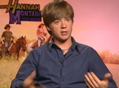 Emily Osment and Jason Earles talk about being approached by fans and paparazzi at Hannah Montana: The Movie press junket; March 2009