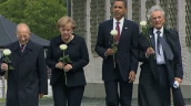 President Barack Obama&sbquo;  German Chancellor Angela Merkel and two second world war veterans walk towards press carrying white roses at Buchenwald Concentration Camp&sbquo; Germany; 03 June 2009