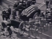 Coffin of assassinated President John F. Kennedy is carried on horse drawn carriage during state funeral procession&sbquo;  Washington D.C.; 25 December 1963