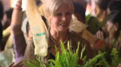 Gurkha campaigner Joanna Lumley is showered with flowers during her visit to Nepal; 27 July 2009
