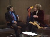 Sir Michael Parkinson talks to camera about emus as Rod Hull enters studio with Emu; November 1976
