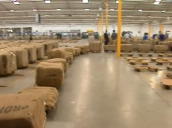 Train of bails travels through factory floor ahead of annual tobacco auction&sbquo;  Zimbabwe; 2000s