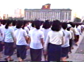 Feet and legs marching in unison in women\%27s parade&sbquo;  women march past camera&sbquo; North Korea