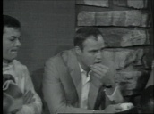 Marlon Brando&sbquo;  James Garner&sbquo; Tony Curtis and others listen to Charlton Heston reading pro-Civil Rights speech at his home&sbquo; Beverly Hills; 18 Aug 63