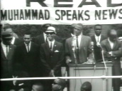 Malcolm X on platform giving speech at rally&sbquo;  Harlem; 1960s