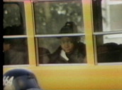 African-American girl seen through window of yellow school bus used in "bussing" policies&sbquo;  Boston; 1970s