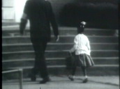 Marshals escorting Ruby Bridges into William Frantz Elementary School after court ruling on racial integration&sbquo;  New Orleans; 14 Nov 60