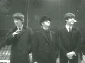 George Harrison&sbquo;  Ringo Starr and Paul McCartney pose and wave for cameras during interview&sbquo; Ringo smoking&sbquo; Washington DC; 11 Feb 64