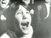 Girls screaming as they await an appearance by the Beatles during their USA tour; 1965