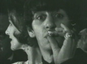 Ringo Starr looks at camera and puffs his cigarette several times and smiles&sbquo;  pan left to John Lennon&sbquo; Washington DC; 11 Feb 64