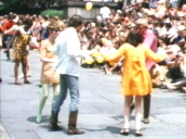 Mod couples dance in front of crowd wearing sixties style clothing&sbquo;  Central Park; 1967