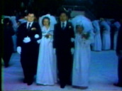 Many brides and grooms at Moonie mass wedding service&sbquo;  USA; 1970s