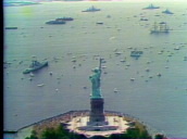 Fleet of tall ships sailing into New York Harbour past Statue of Liberty&sbquo;  Bicentennial Celebrations; 04 Jul 76