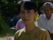 Aung San Suu Kyi walking in garden of her house in Rangoon; 10 July 96