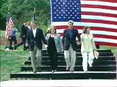 John Kerry&sbquo;  Teresa Heinz&sbquo; John and Elizabeth Edwards walk down steps towards camera (huge USA flag behind them)&sbquo; North Carolina&sbquo; 09 Jul 04
