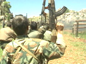 PKK soldiers march and chant with AK 47\%27s held in the air&sbquo;  Lebanon&sbquo; 1991
