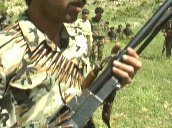 Tilt down over PKK soldier holding rifle and bullets&sbquo;  Bekaa Valley&sbquo; Lebanon; 1991