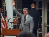 Zoom in as Presidential candidate Jimmy Carter waves at lecturn during campaign trail&sbquo;  Warm Springs&sbquo; Georgia; 07 Sep 76