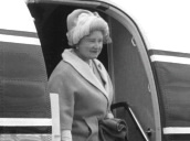 Queen Mother steps of plane at Aberdeen Airport and shakes hands with officials; 18 Aug 67