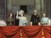 King George VI&sbquo;  Queen Elizabeth (later Queen Mother)&sbquo; Princess Elizabeth (later Queen Elizabeth II) and Princess Margaret come onto balcony of Buckingham Palace to wave to crowds celebrating end of W