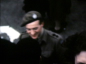 David Niven in army uniform shakes hands with members of crowd celebrating announcement of VE Day in London&sbquo;  08 May 45
