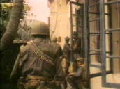 US marines take up positions around side of abandoned university building during operation to recapture Hue from North Vietnamese forces; Feb 68