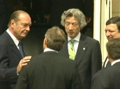 President Jacques Chirac of France pats Prime Minister Tony Blair on shoulder in concerned gesture following London bombings of July 7th 2005 as Prime Minister of Japan Junichiro Koizumi and EU Presid
