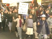 Row of armed police watch protestors chant for peace and walk in anti Gulf war demonstration on west coast of America&sbquo;  USA; 15 Jan 91