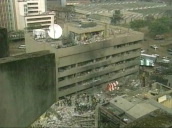Rescuers climb over rubble amongst bomb damaged US embassy buildings following car bomb attack by al Qaeda terrorists&sbquo;  Nairobi; 08 Aug 98
