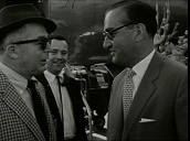 Director Billy Wilder and actor Jack Lemmon step from aircraft on arrival in Vienna; 1959
