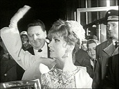 Italian actress Gina Lollobrigida waves to crowd as she arrives at film premiere&sbquo;  Vienna; 1966